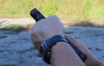 Gripping a Walther Q5 pistol slide serrations