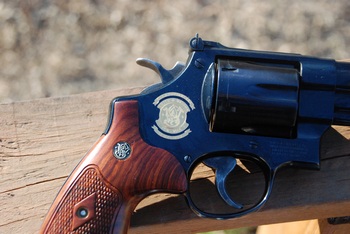 Smith and Wesson 50th Anniversary seal on the side of the revolver
