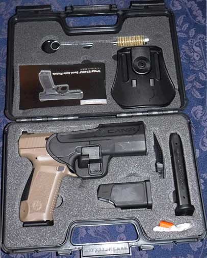 Canik TP9SF 9mm pistol in the box with holster, 2 magazines, back straps, lock, load assist device, and manual