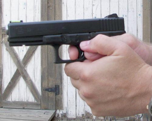 Two Handed Grip On A GLOCK Pistol